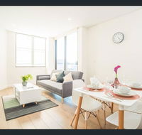 Gorgeous modern brand new two bedroom apartment with large lounge and private garden view balcony - Accommodation 4U